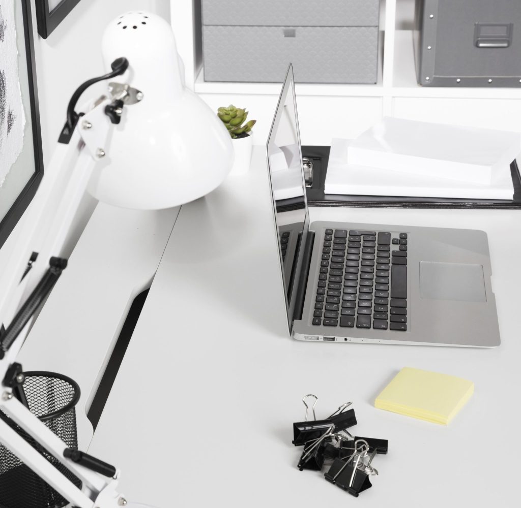 close up tidy workspace with laptop scaled e1745922088134